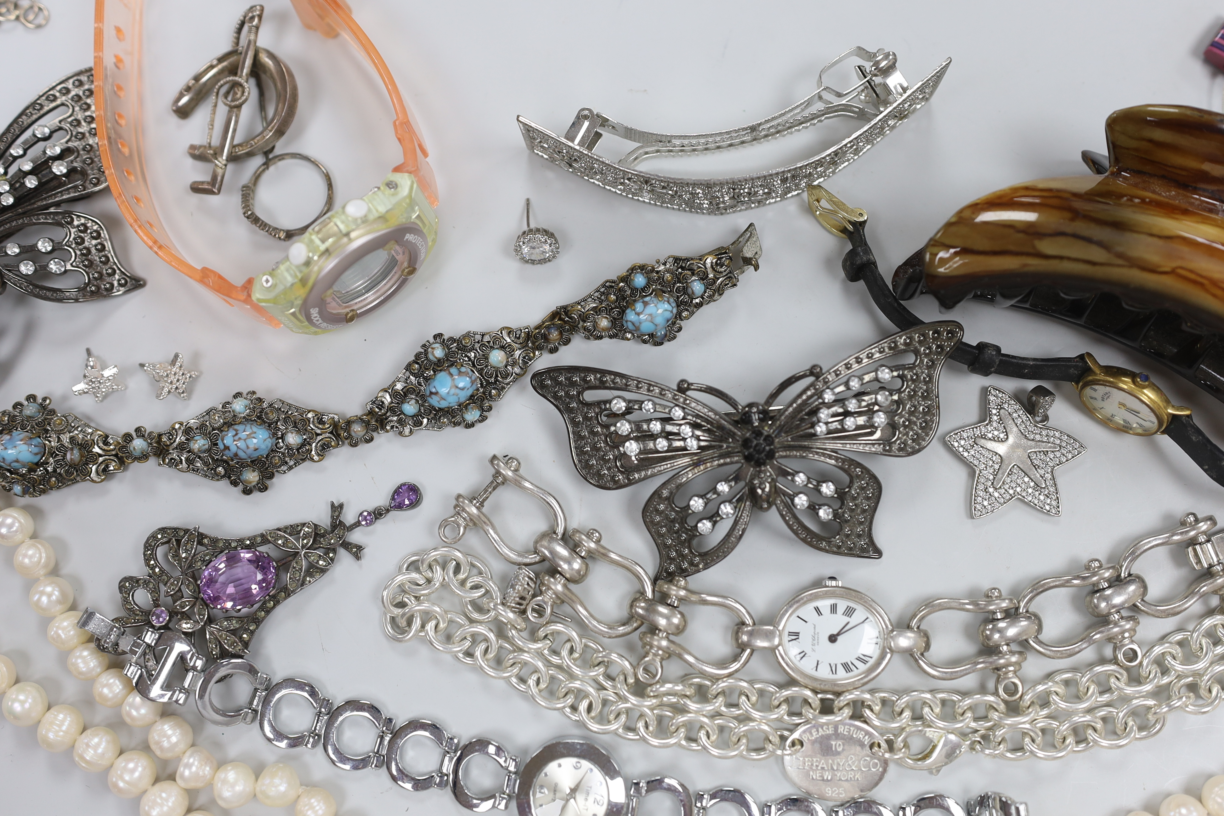Four assorted 9ct gold and gem set rings, gross weight 6.3 grams, a 925 and rose quartz bracelet, a silver bracelet watch, a silver horseshoe and riding crop brooch and other jewellery including costume.